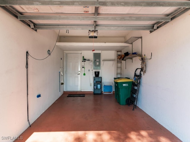 garage featuring electric panel and a garage door opener