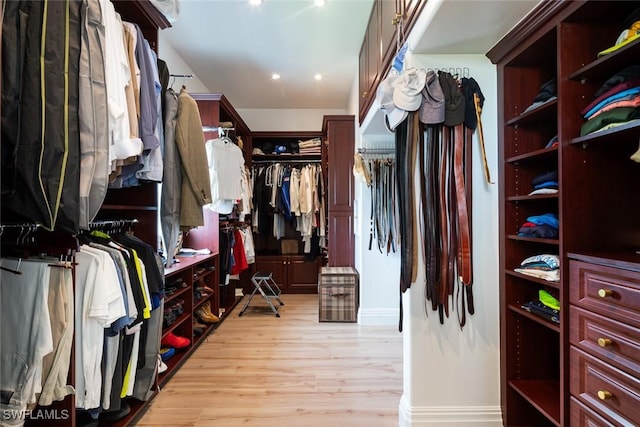 walk in closet featuring light wood finished floors