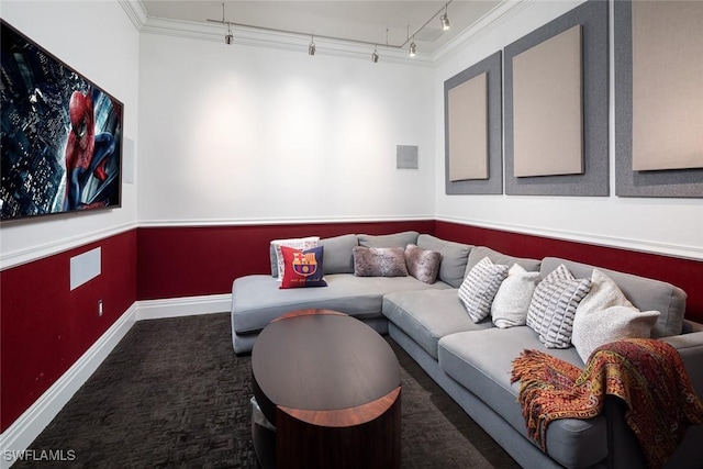 living room featuring ornamental molding, rail lighting, carpet floors, and baseboards