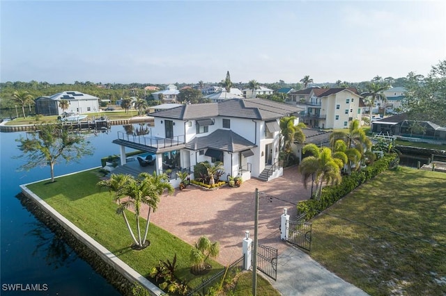 bird's eye view featuring a water view and a residential view