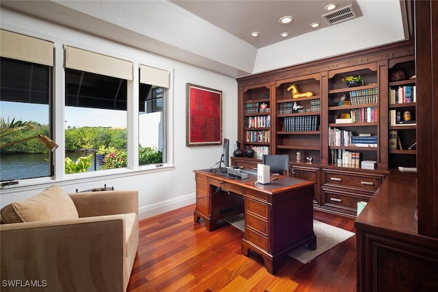 office featuring recessed lighting, wood finished floors, visible vents, and baseboards