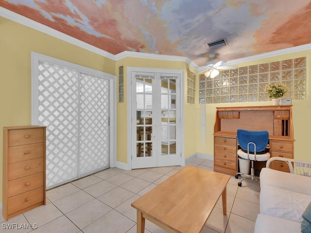 interior space with light tile patterned floors, a ceiling fan, visible vents, french doors, and crown molding