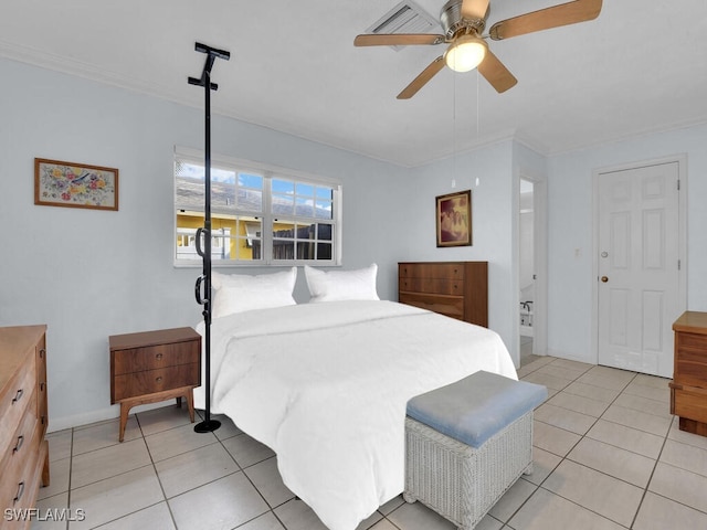 bedroom with ceiling fan, light tile patterned flooring, and baseboards