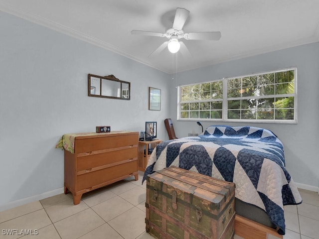 bedroom featuring ornamental molding, baseboards, and light tile patterned floors