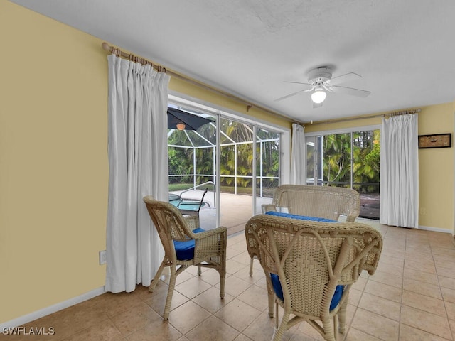 sunroom with ceiling fan