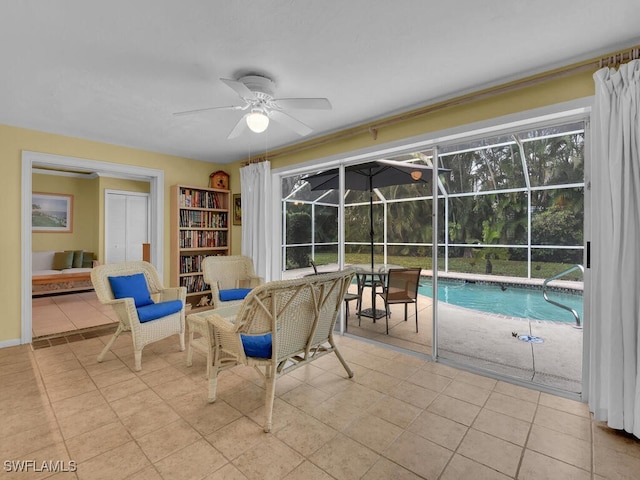 interior space with ceiling fan