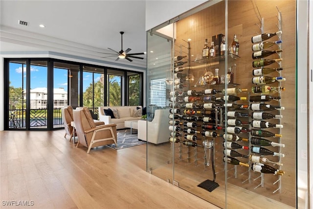 wine room featuring visible vents, recessed lighting, a ceiling fan, and wood finished floors