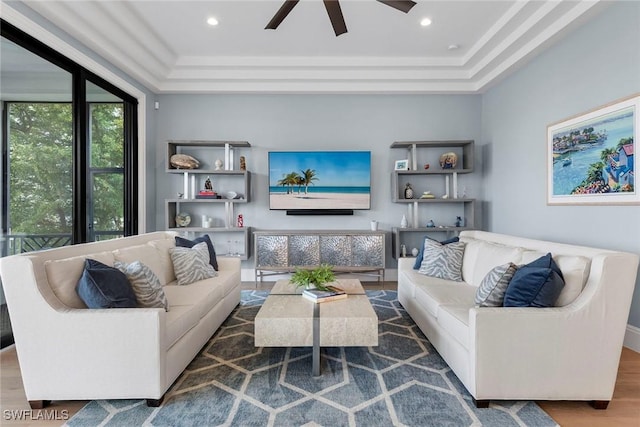 living area with recessed lighting and wood finished floors