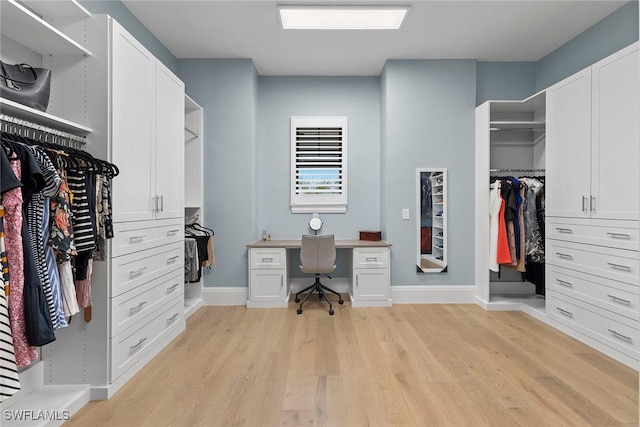 walk in closet featuring light wood-style floors