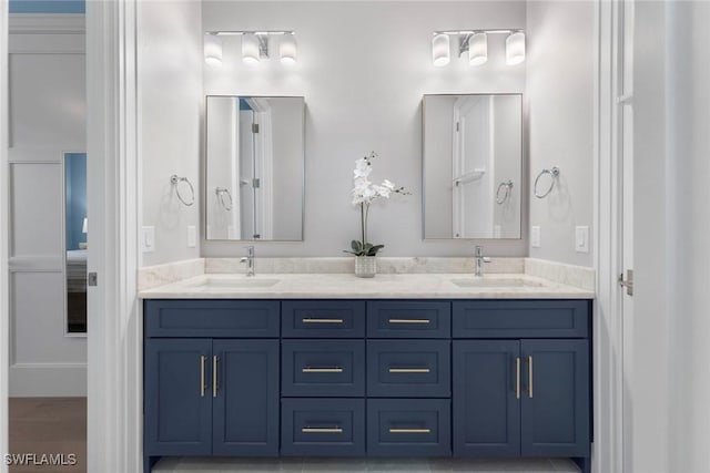 bathroom featuring double vanity and a sink