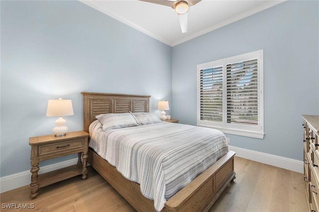 bedroom with baseboards, ceiling fan, and light wood finished floors