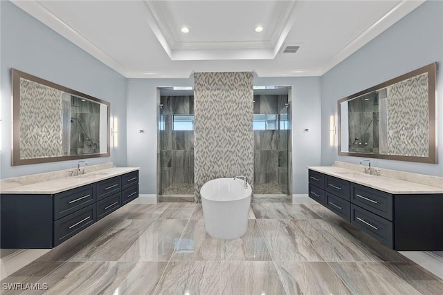 full bath with a shower stall, two vanities, and a sink