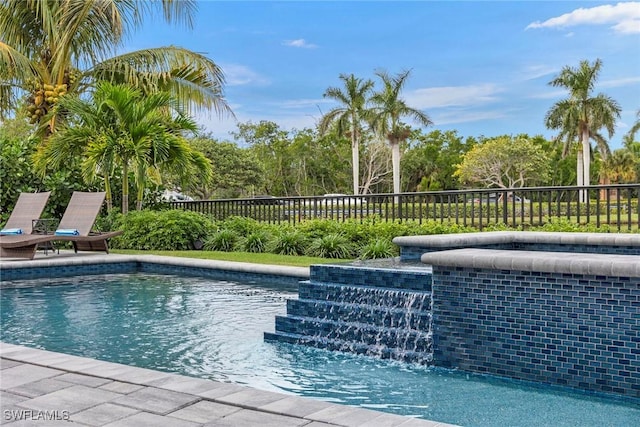 view of swimming pool with a fenced in pool and fence