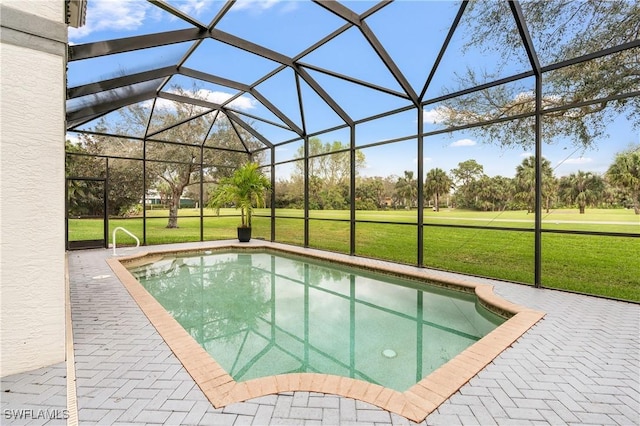 outdoor pool with glass enclosure, a yard, and a patio