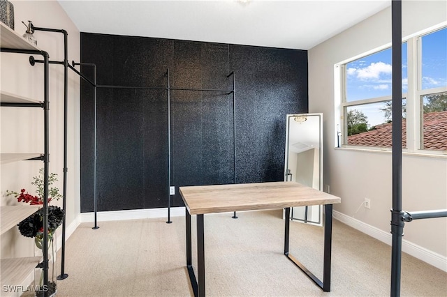 home office with light carpet and baseboards