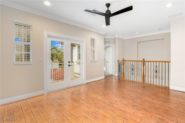 unfurnished room with baseboards, ceiling fan, light wood-style floors, and crown molding