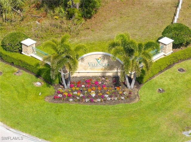 community sign featuring a lawn