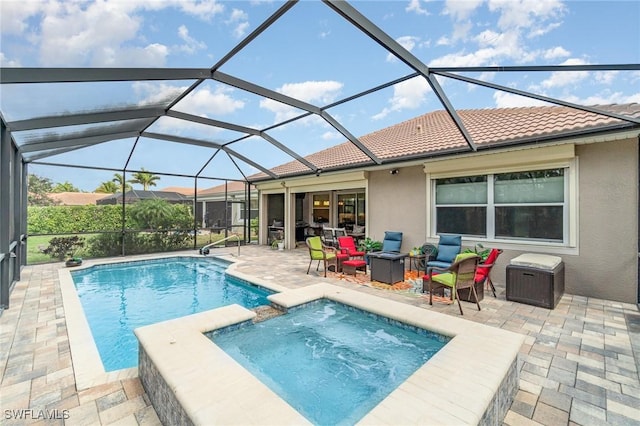 view of swimming pool featuring a patio area, a pool with connected hot tub, and glass enclosure