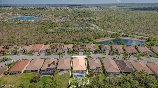 birds eye view of property with a residential view and a water view