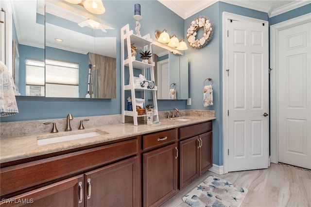 bathroom with double vanity, a sink, and crown molding