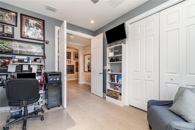 office area featuring arched walkways, visible vents, baseboards, and light tile patterned floors