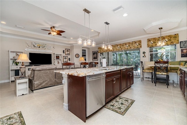 kitchen with hanging light fixtures, a kitchen island with sink, and dishwasher