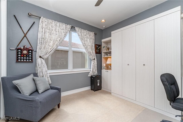 interior space with baseboards, a ceiling fan, and recessed lighting