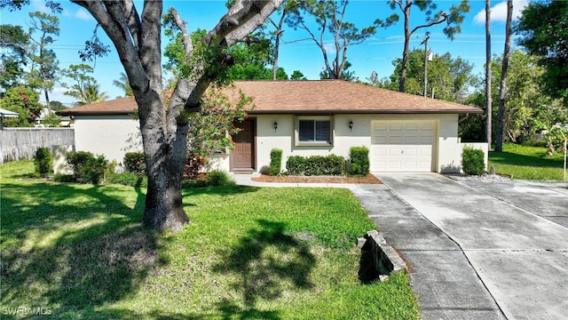 ranch-style home featuring a front yard, concrete driveway, an attached garage, and stucco siding