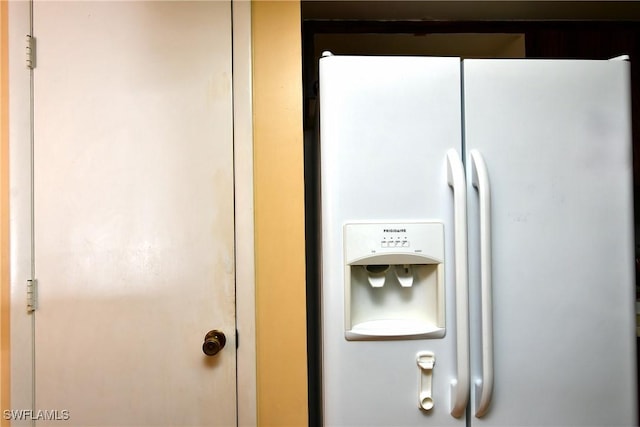 interior details with white refrigerator with ice dispenser