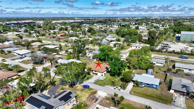 birds eye view of property with a residential view