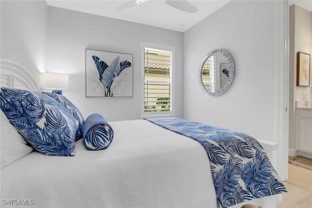 bedroom featuring a ceiling fan and ensuite bathroom