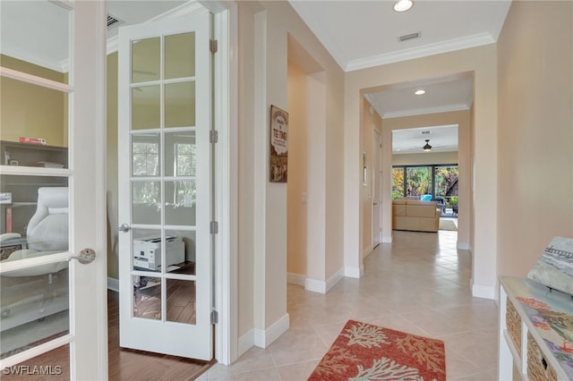 doorway featuring french doors, crown molding, recessed lighting, visible vents, and baseboards