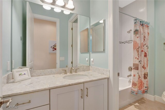 full bathroom with shower / tub combo with curtain, vanity, and toilet