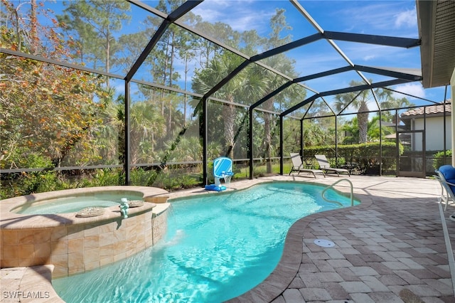 view of swimming pool featuring a patio, a lanai, and a pool with connected hot tub