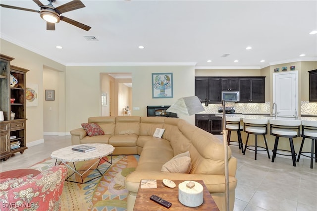 living room featuring ornamental molding, recessed lighting, ceiling fan, and light tile patterned floors