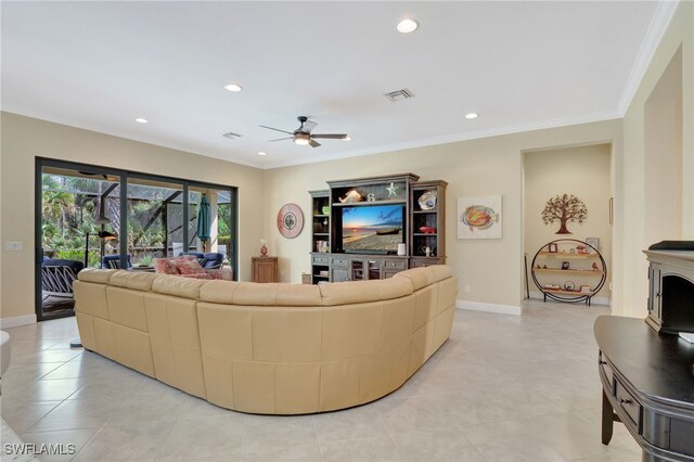 living room with baseboards, visible vents, a ceiling fan, crown molding, and recessed lighting