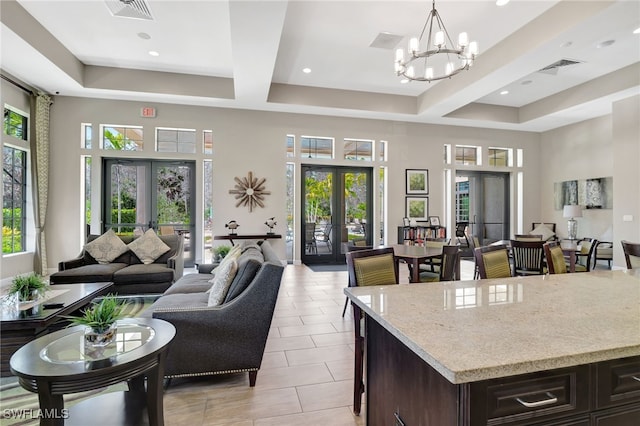 interior space featuring open floor plan, dark brown cabinets, and french doors