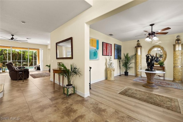 8840 Paseo De Valencia St, Fort Myers, FL 33908 - hall featuring visible vents, baseboards, and wood finished floors