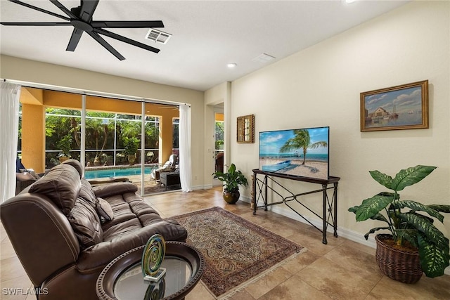 8840 Paseo De Valencia St, Fort Myers, FL 33908 - living room featuring a ceiling fan, a sunroom, visible vents, and baseboards