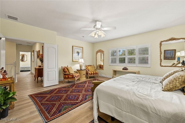 8840 Paseo De Valencia St, Fort Myers, FL 33908 - bedroom with visible vents, ceiling fan, light wood-style flooring, and baseboards