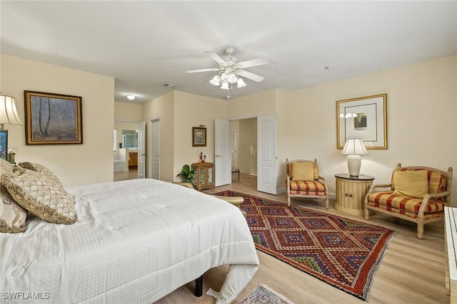 8840 Paseo De Valencia St, Fort Myers, FL 33908 - bedroom with ceiling fan, wood finished floors, and visible vents