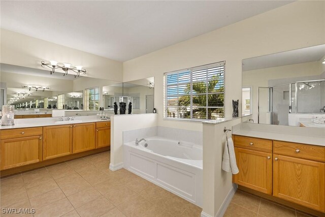 8840 Paseo De Valencia St, Fort Myers, FL 33908 - full bathroom featuring a bath, tile patterned flooring, a shower stall, and vanity