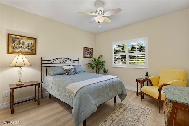 8840 Paseo De Valencia St, Fort Myers, FL 33908 - bedroom with baseboards, ceiling fan, and light wood-style floors