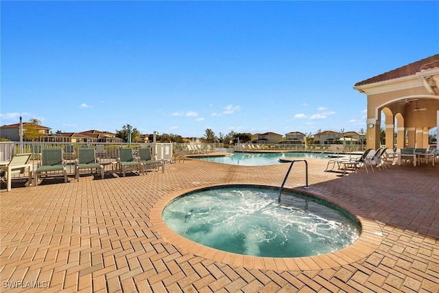 8840 Paseo De Valencia St, Fort Myers, FL 33908 - community pool featuring a patio and a community hot tub