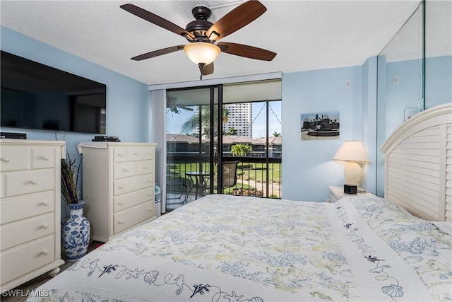 bedroom with a textured ceiling, floor to ceiling windows, access to outside, and ceiling fan