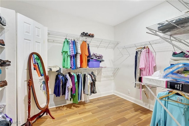 walk in closet featuring wood tiled floor