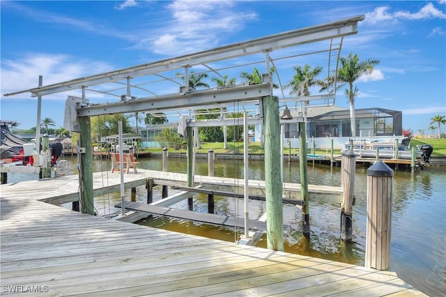 dock area featuring a water view and boat lift