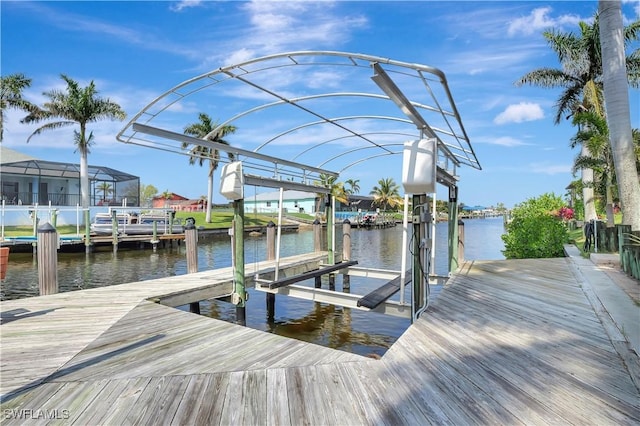 view of dock with a water view and boat lift