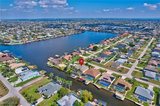 aerial view featuring a residential view and a water view