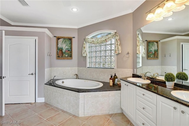 full bath with a garden tub, tile patterned flooring, a sink, visible vents, and ornamental molding